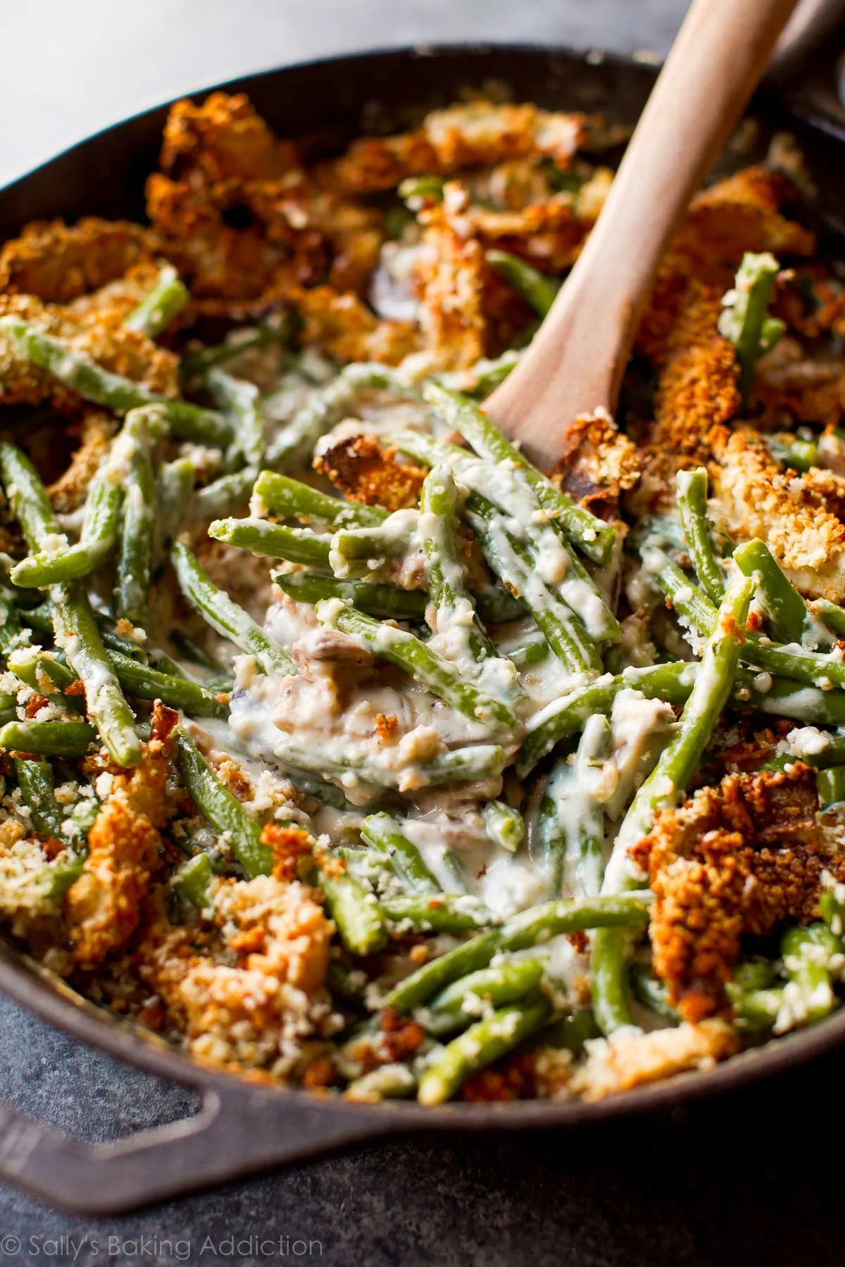 Creamy green bean casserole dish topped with crunchy fried onions
