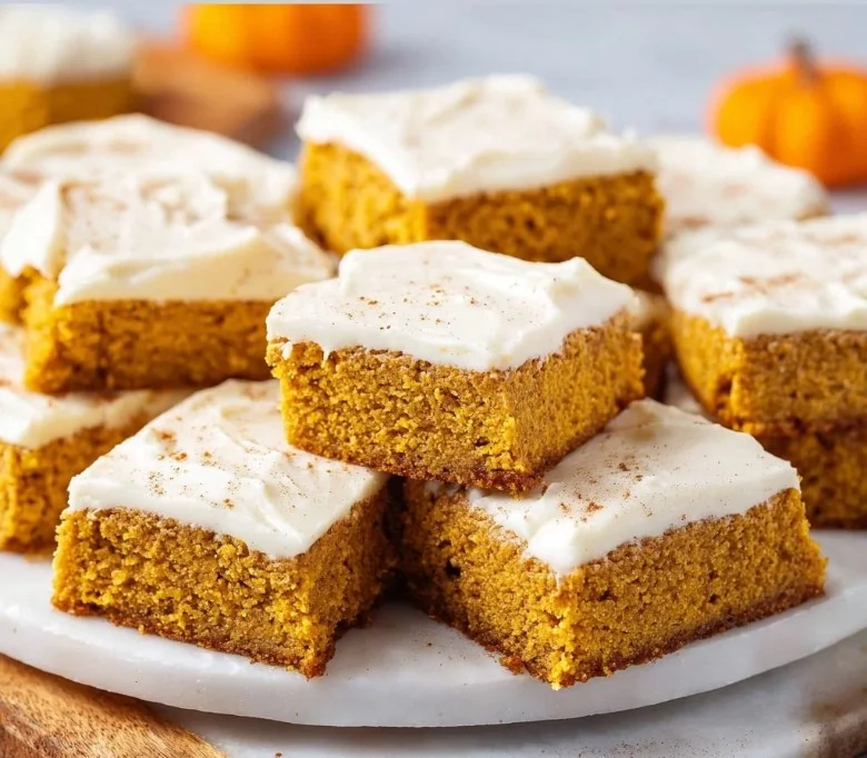 Delicious homemade easy pumpkin bars topped with cream cheese frosting.