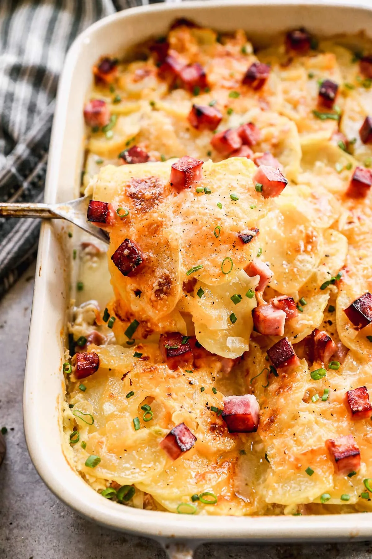 Delicious scalloped potatoes and ham served in a creamy sauce